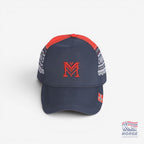 Fanshoppen Norge navy blue baseball cap with red embroidered 'M' and traditional Norwegian pattern on sides. Red brim.