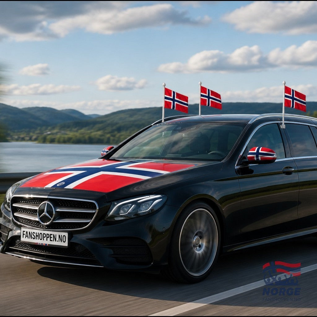 Fanshoppen Norge car decorated with Norwegian flags on hood, mirrors, and roof. White sedan parked on scenic road.